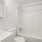 bright bathroom with shower/tub combo