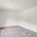 carpeted bedrom with window