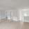 spacious, upstairs living room with kitchen access