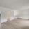 large, naturally lit living room on second floor adjacent to kitcjen