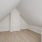 cozy loft area with pitched ceiling and closet