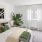 Bedroom with natural lighting and high ceilings